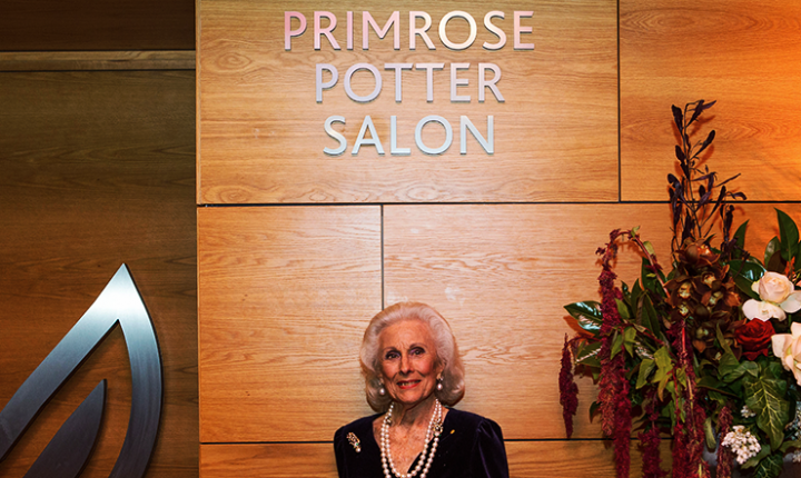 Lady Primrose Potter standing outside the entrance of the Salon Lady Primrose Potter standing outside the entrance of the Salon